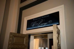 Sign for the Domaine Serene Wine Lounge at Sentinel Hotel