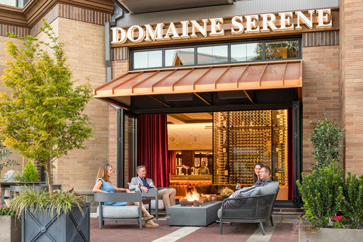 people sitting on patio at Domaine Serene Wine Lounge Lake Oswego